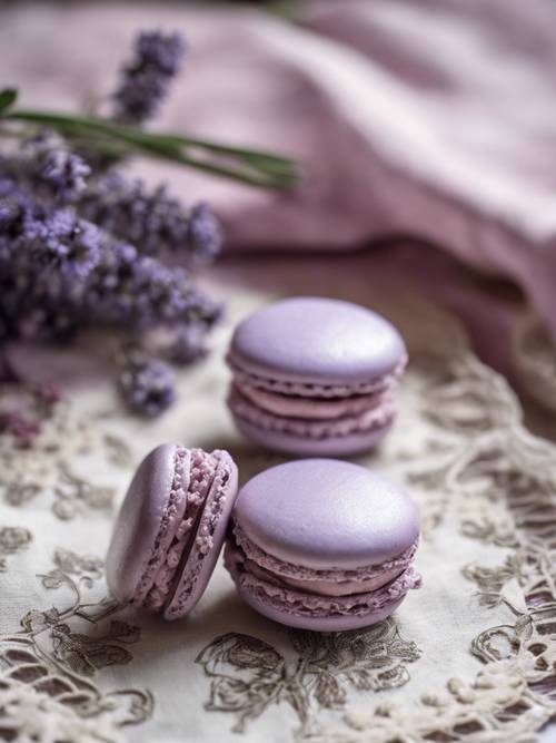 A lavender macaron placed on an antique, lace tablecloth.