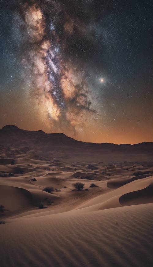 Una splendida galassia della Via Lattea che adorna il cielo notturno sopra un deserto spazzato dal vento.
