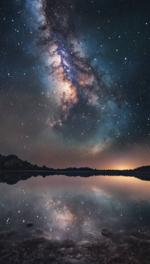 A mesmerizing view of the Milky Way galaxy reflected in a calm, crystal clear lake.