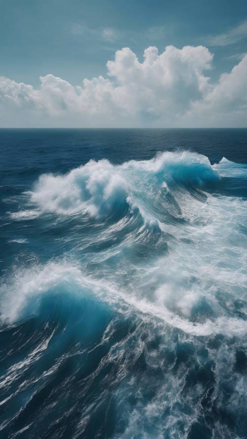 鸟瞰一片深蓝色的广阔海洋，强大的海浪相互冲击着。