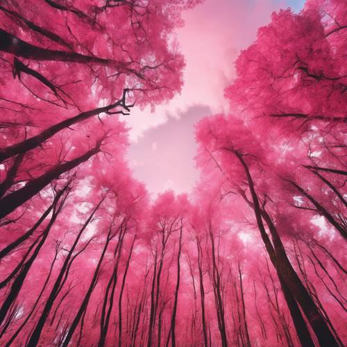 A vibrant landscape of pink clouds leisurely floating over a colorful fall forest.