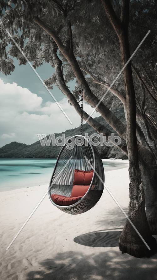 Relaxing Beach Swing with Red Cushions Under the Shade of Trees
