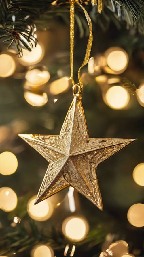 A shiny gold star ornament hung on a Christmas tree with twinkling fairy lights.