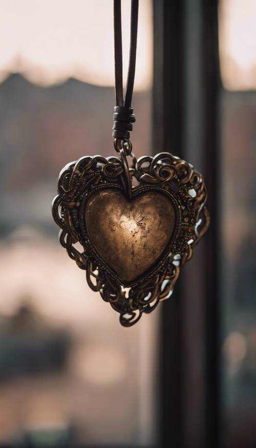 A grungy heart-shaped pendant, hanging from a leather cord, in a dimly lit room reflecting indie vibes.