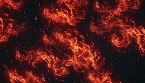 Intense red flames forming a unique pattern against a dark night.