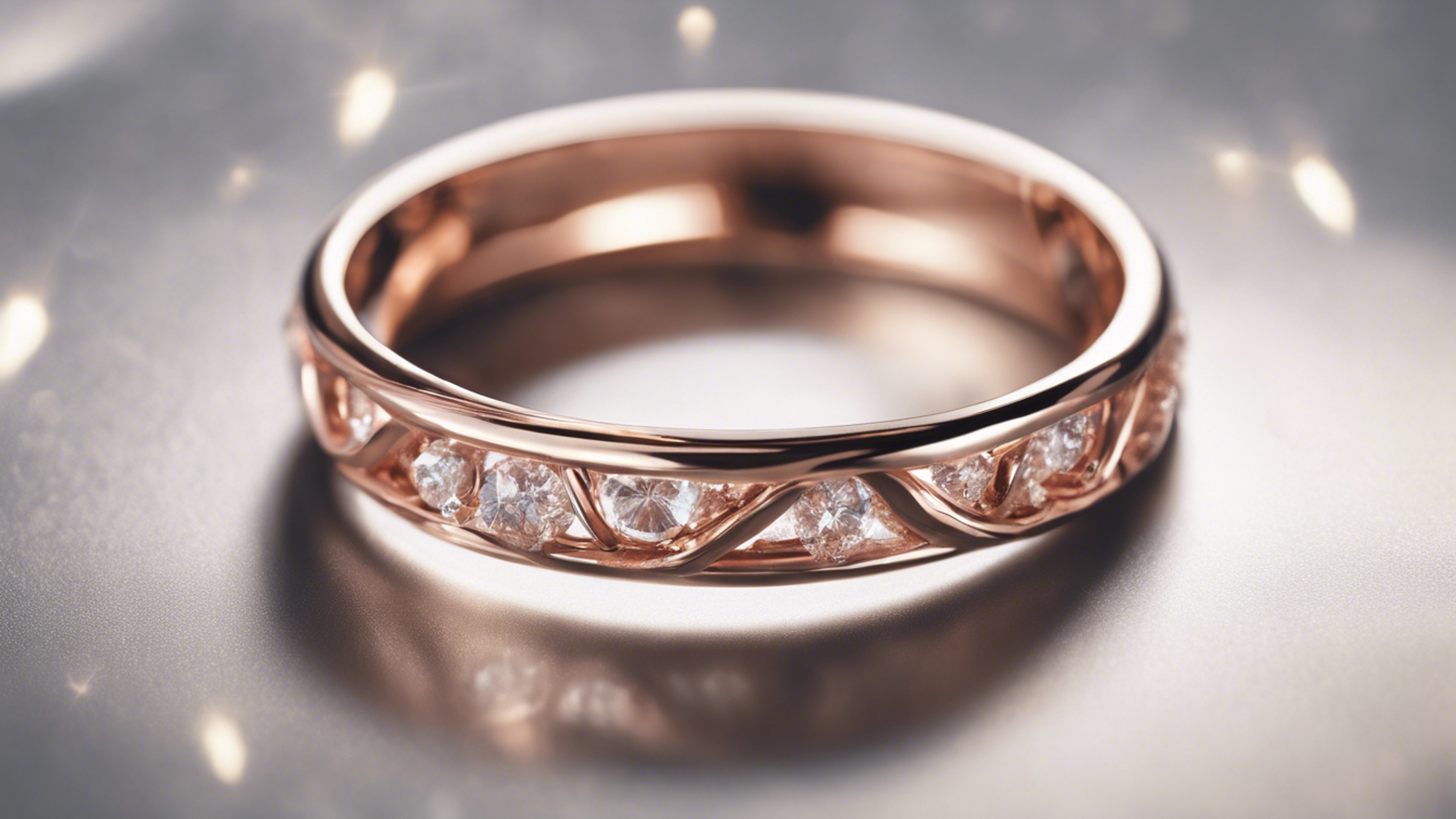 A close-up of a shiny, wing-designed rose gold ring on a ring display.壁紙[e81f1852b98946d98654]
