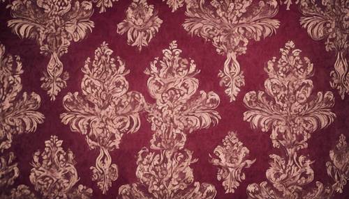 Noble burgundy damask fabric, worn and faded through time.