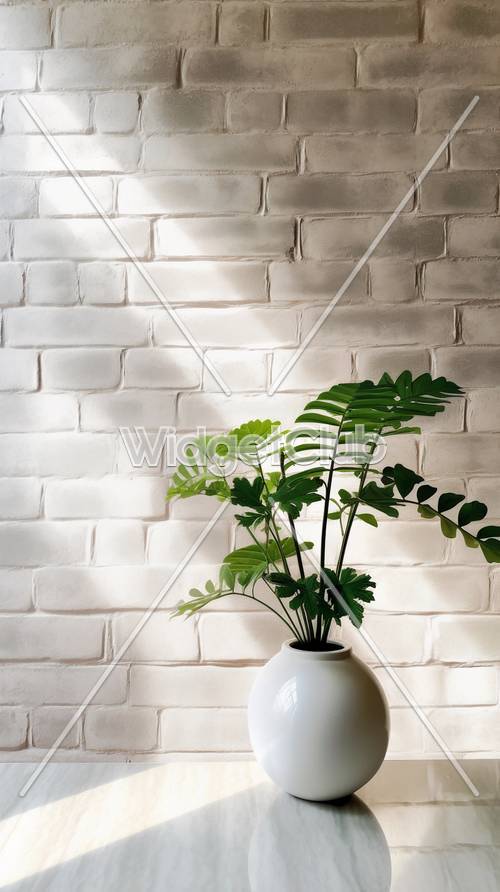 上品な白いレンガと緑の植物の壁紙