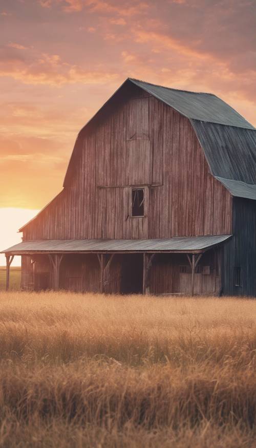 A soft pastel colored sunrise over a country barn in a rustic setting.