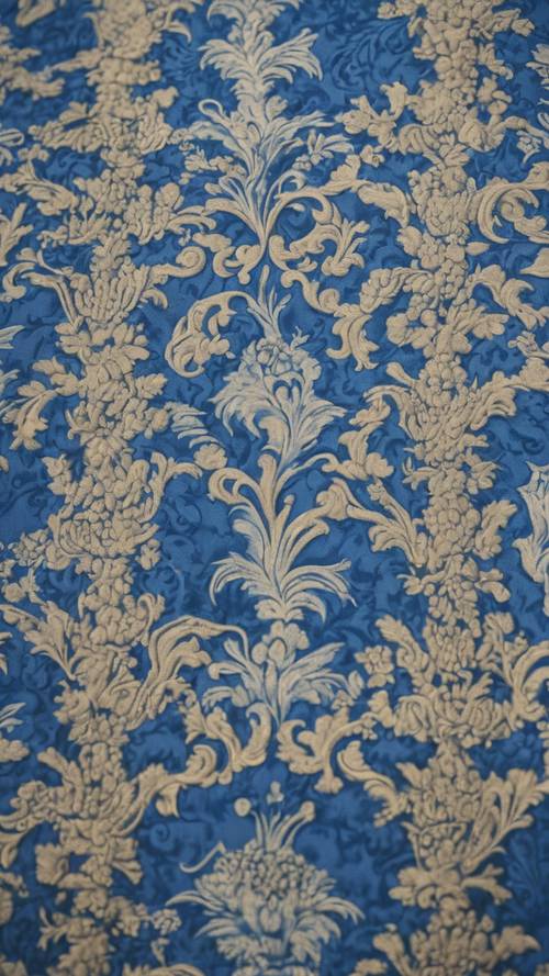 A detailed shot of blue damask fabric used for royal robes in Victorian England.