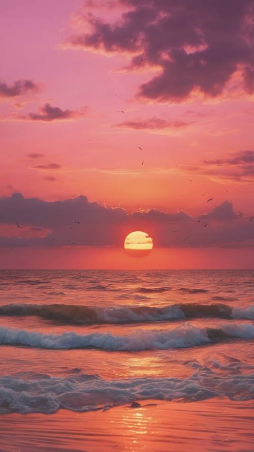 해변가의 하늘을 주황색과 분홍색으로 물들이는 고요한 일몰.