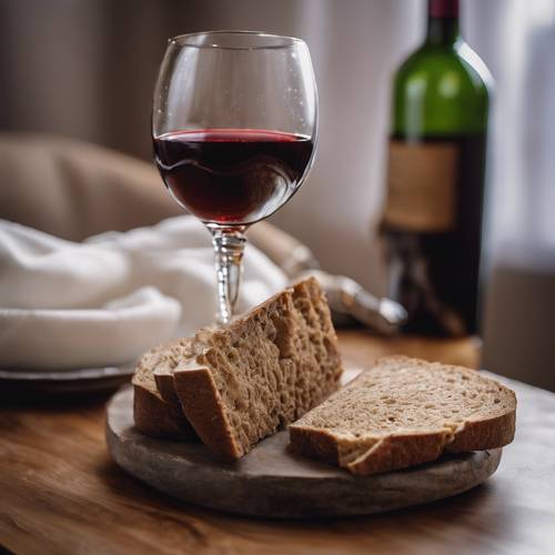 A piece of toasty brown bread and a wine-filled chalice, put side-by-side for Holy Communion.