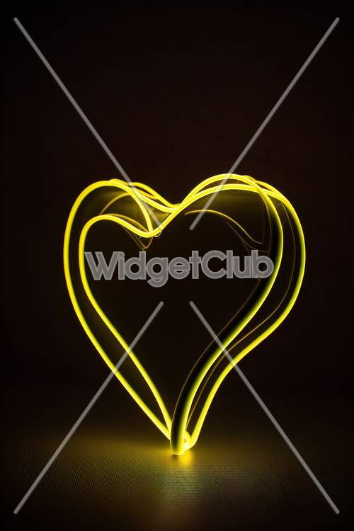 Luce al neon gialla brillante a forma di cuore