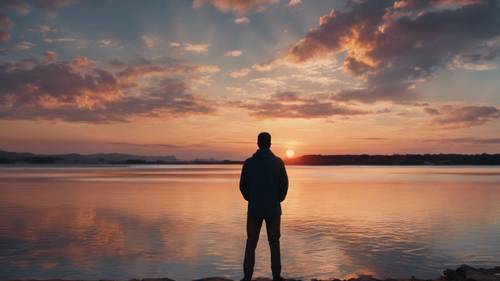 Un uomo osserva uno splendido tramonto con la scritta &quot;Valuto e apprezzo le cose semplici&quot; che appare nei colori vivaci.