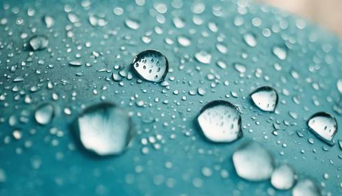 An aesthetic closeup of raindrops on a baby blue umbrella.