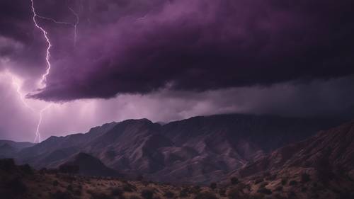 Light illuminating through dark purple storm clouds over a desolate mountainscape.