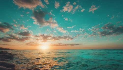 A dreamy teal sun set over deep turquoise waters stirring with marine life.