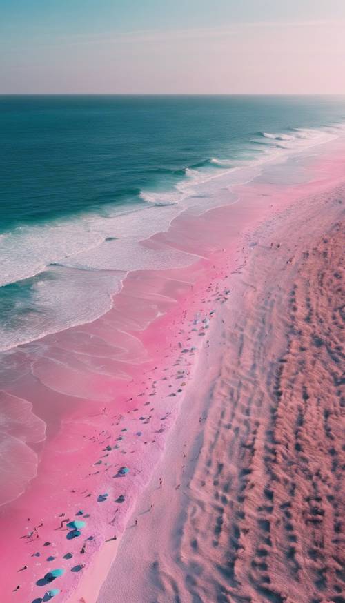 An aerial view of a beautiful beach with pink and blue ombre sands.