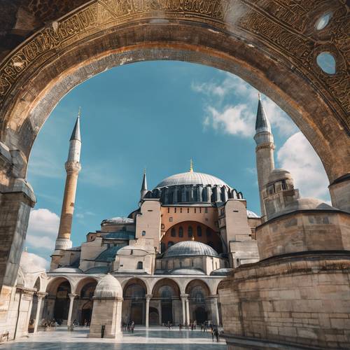 The Hagia Sophia in Istanbul, with its magnificent domes and minarets, against a blue sky.