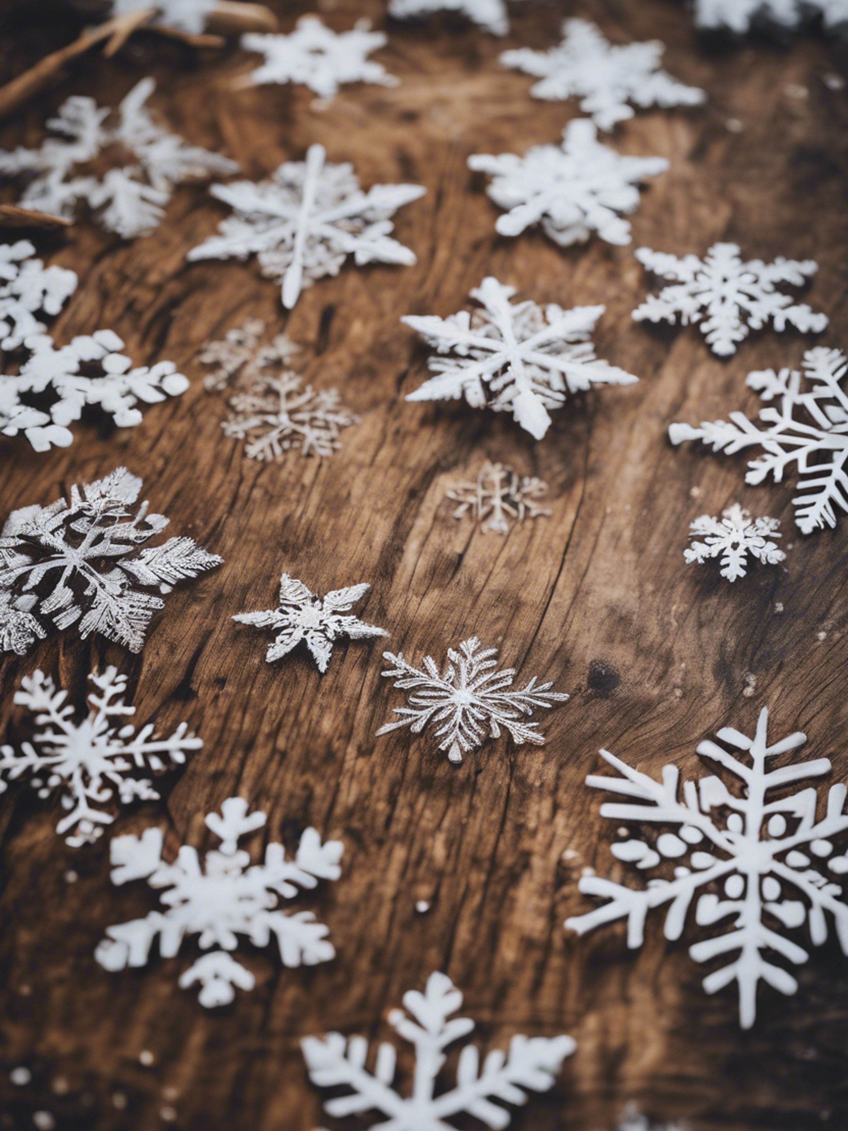 Snowflakes creating a beautiful pattern on a wooden tabletop. Wallpaper[7d0fdac325ca414bb9ff]