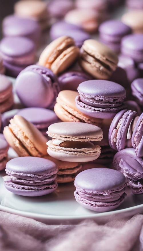 A collection of pastel purple macarons arranged prettily on a white plate.
