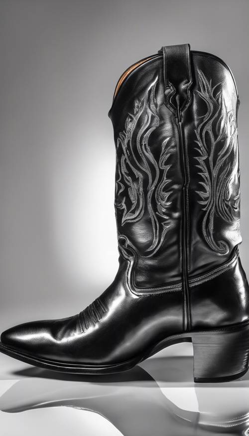 A black cowboy boot against a white background, with the reflection of a cowboy and his hat in its polished surface. Тапет [922d61e31fa04ef4af45]