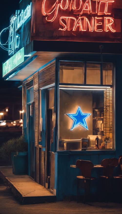 Letrero de neón de una estrella azul que brilla intensamente afuera de un restaurante al borde de la carretera que de otro modo sería anodino por la noche.