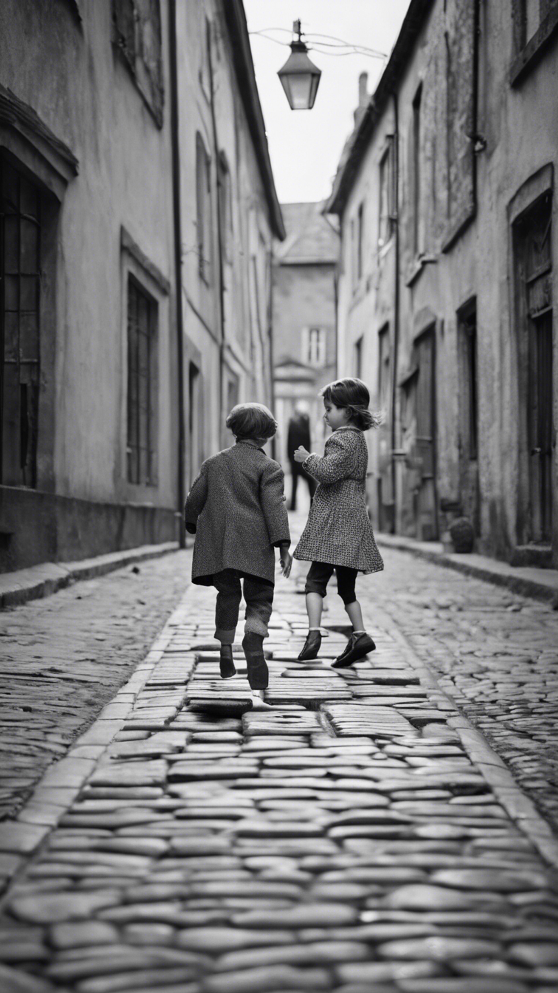 A black-and-white picture of children playing hopscotch on a cobbled street. The scene is bustling with vintage clothing and old buildings indicative of 1940s Europe. Wallpaper[4df91ed9803e41c8b6d7]