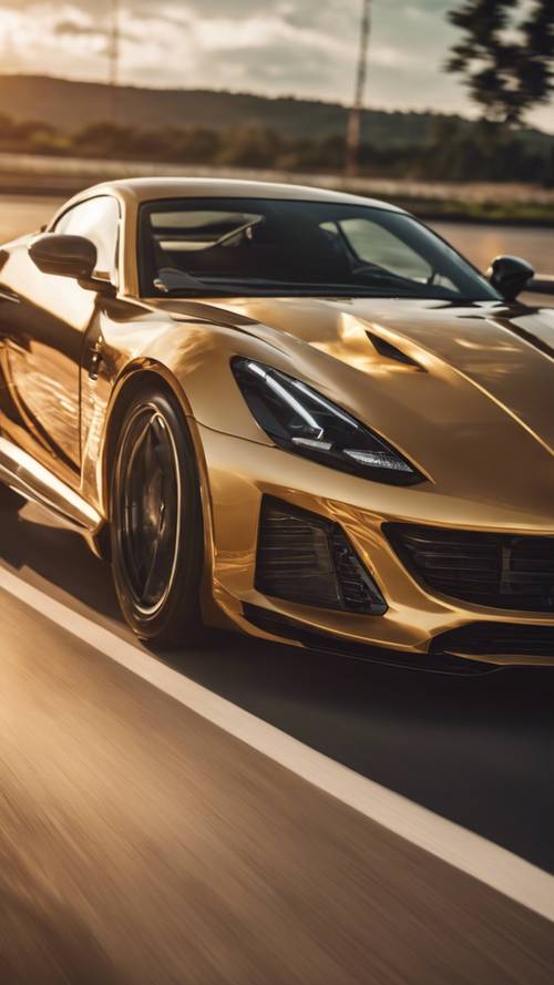 A gold metallic sports car zooming on a highway during sunset.