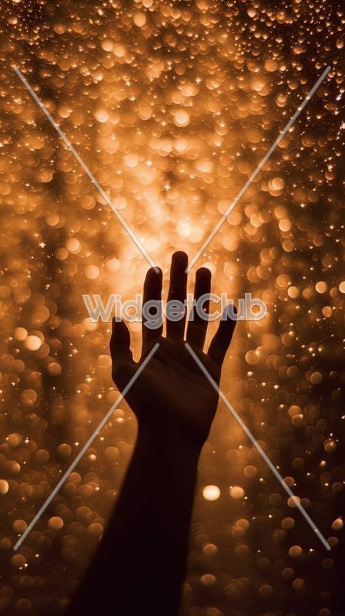 Goldene Lichter berühren Hand Hintergrund