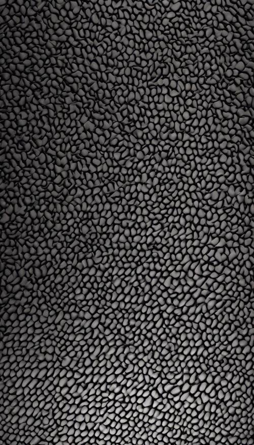 Close-up view of a seamless pattern that showcases the texture of dark carbon fiber