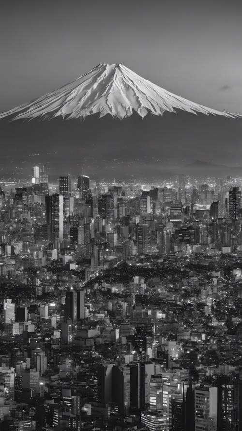 A black and white cityscape of Tokyo with Mount Fuji visible in the background during sunset.