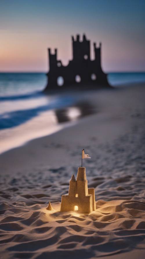 An enchanting moonlit night on Pere Marquette beach with a sandcastle shaped likeness of Lake Michigan.
