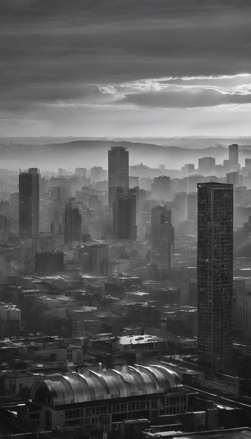 Горизонт города в оттенках серого на рассвете с лучами света, пронизывающими здания.