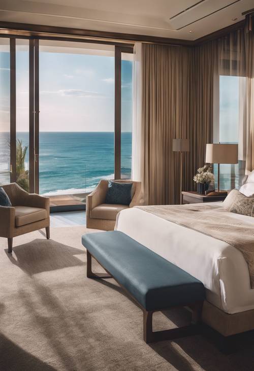 바다가 내려다보이는 천장부터 바닥까지 내려오는 대형 창문이 있는 고급 호텔의 넓은 마스터 침실입니다.