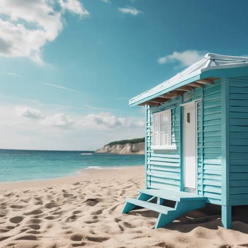A blue and white beach hut on a sunny beach, with turquoise blue seas in the background.