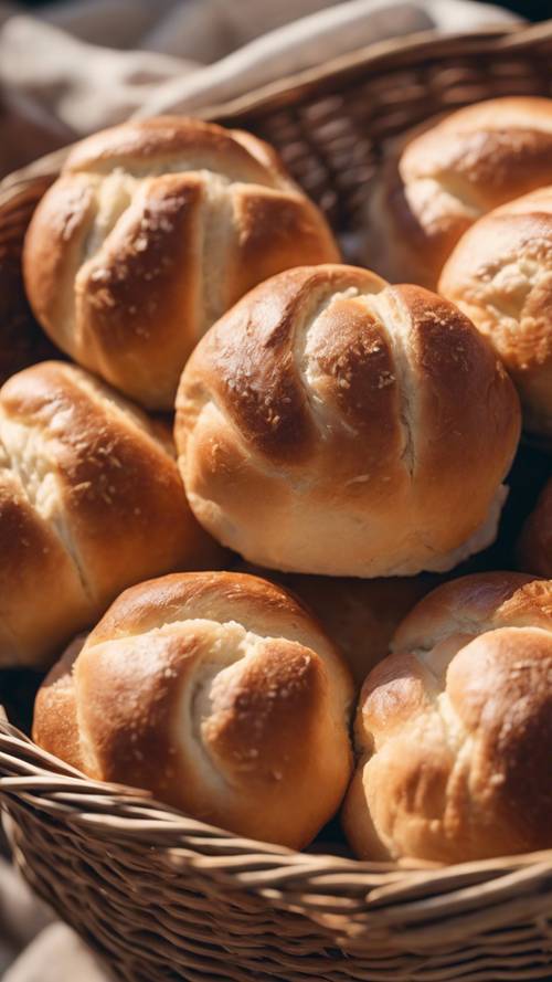 Fluffy dinner rolls sitting in a woven basket, steaming hot fresh from the oven, waiting to be passed around a cozy and inviting Thanksgiving dinner.