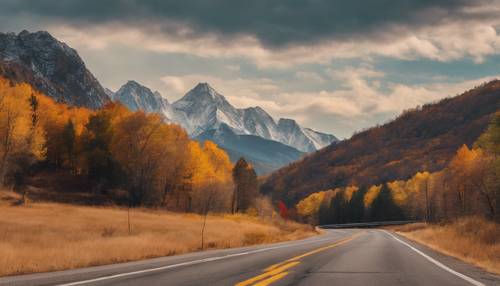 A Thanksgiving Day road trip with mountains displaying their fall colors in the backdrop. Wallpaper [e75d69de9bee40789043]