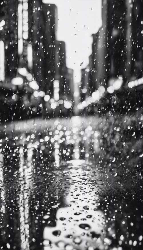 Black and white abstract representation of a rainy cityscape.