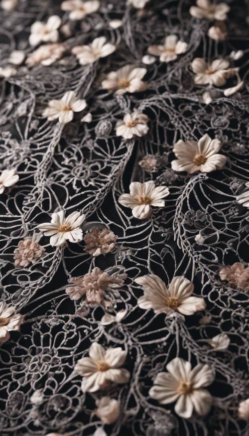An intricate pattern of black lace with delicate flowers.