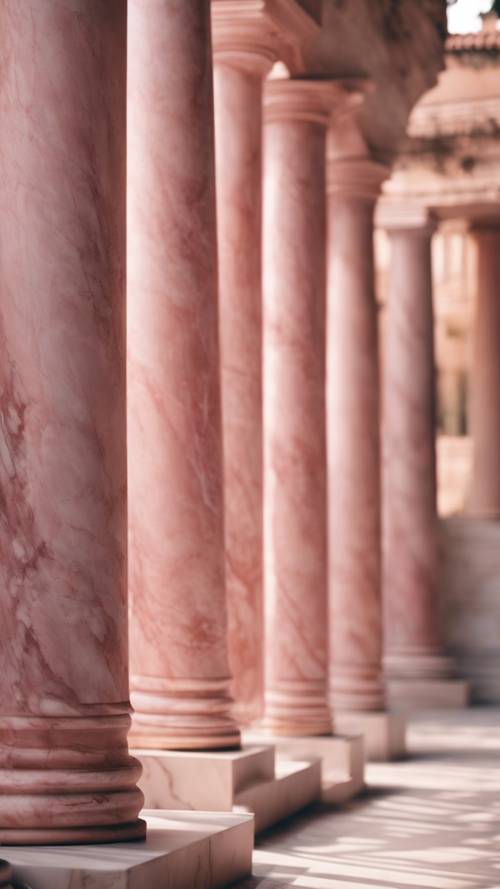 Architectural columns made from pink marble in an ancient Greek building.