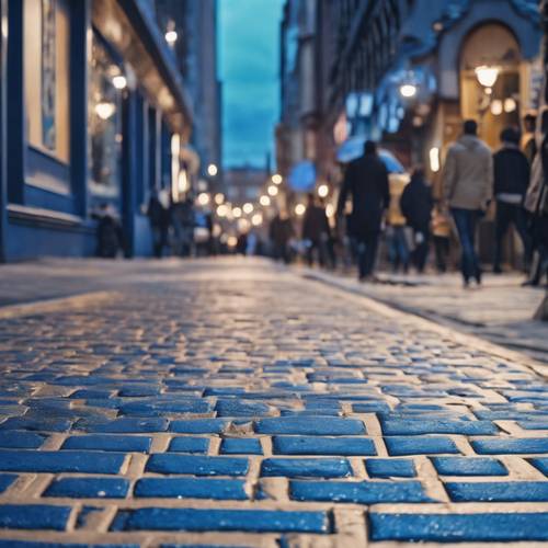Textured blue brick sidewalk on a busy city street.