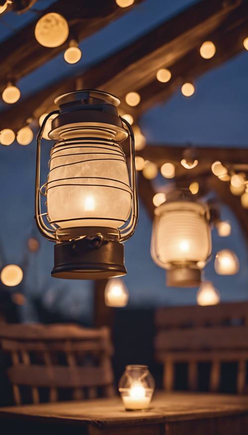 Cream-colored lantern-lights glowing warmly against the darkening twilight sky, suspended over a charming outdoor patio equipped with comfy seating arrangements.