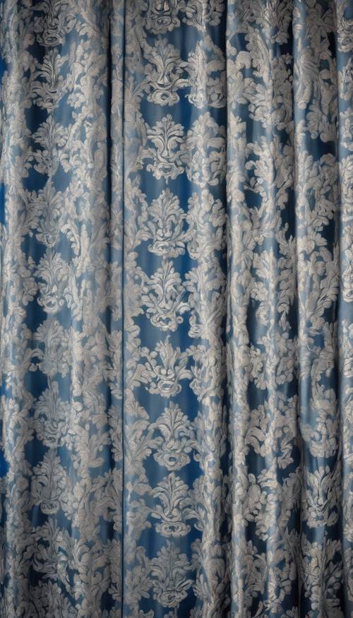 An intricate blue and silver damask pattern on a Victorian-style curtain.