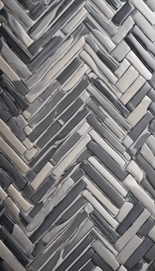 Close-up view of a detailed gray herringbone pattern on a modern kitchen backsplash.