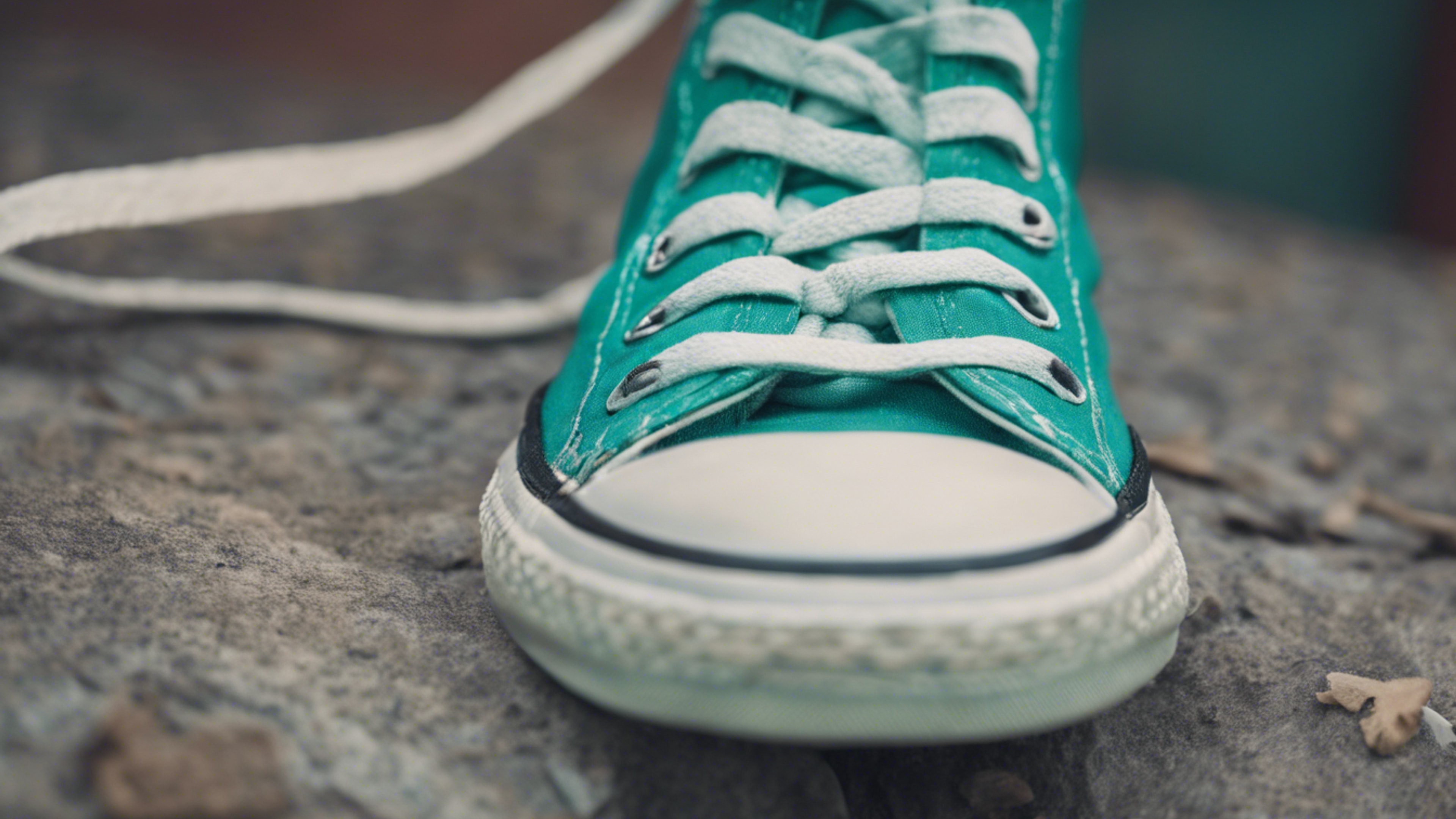A close-up of a pair of cool teal colored Converse sneakers. Taustakuva[fe0f07076e3947159bbd]