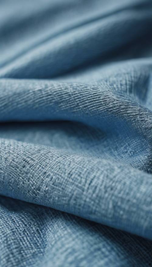 Zbliżenie na świeżo wypraną i wyprasowaną niebieską tkaninę lnianą.