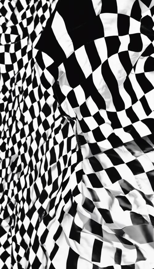 A black and white checkered flag fluttering in the wind at the finish line of a car racing track.