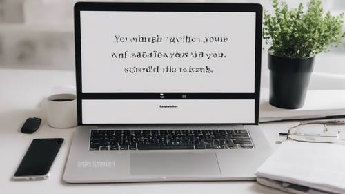 An open laptop on a clean white desk, with the screen displaying a motivational studying quote.