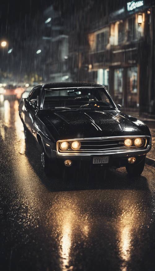 Classic black muscle car speeding on a rainy night.